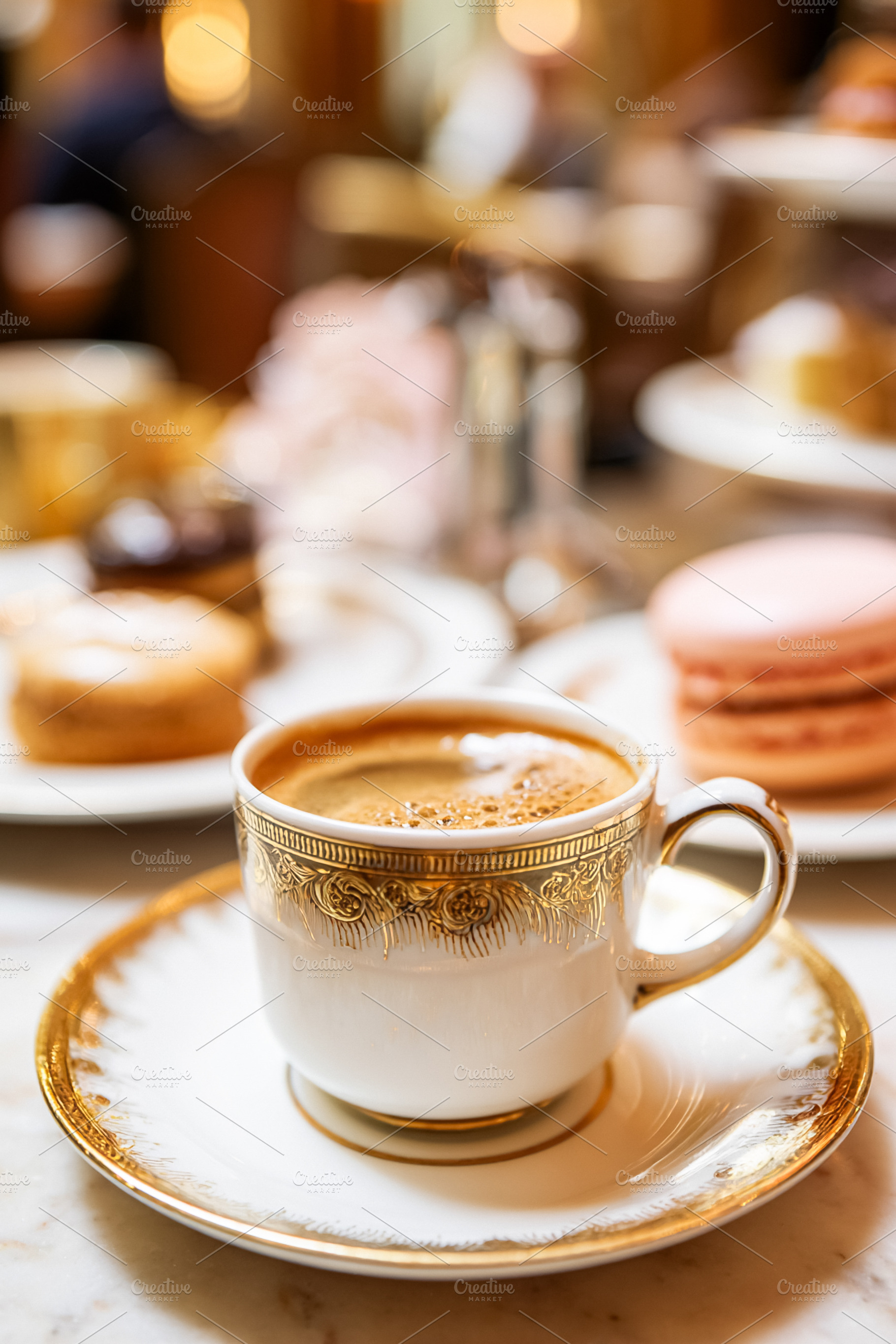Hot coffee served in a refined gold rimmed porcelain cup on a ma, a Food & Drink Photo by Studio ANNA