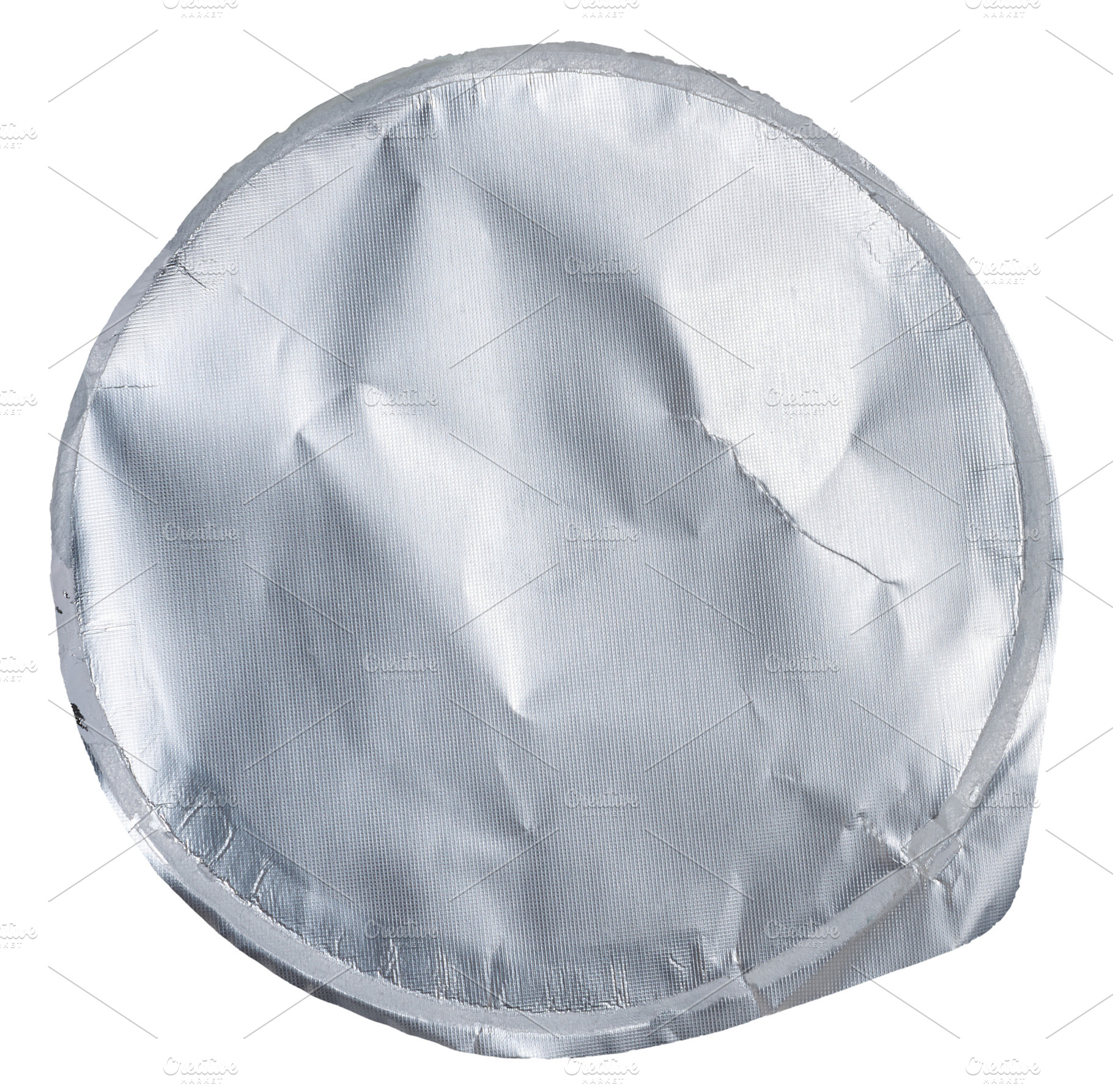 Close-up of a crumpled round foil yogurt lid on an isolated back, an Industrial Photo by ndanko