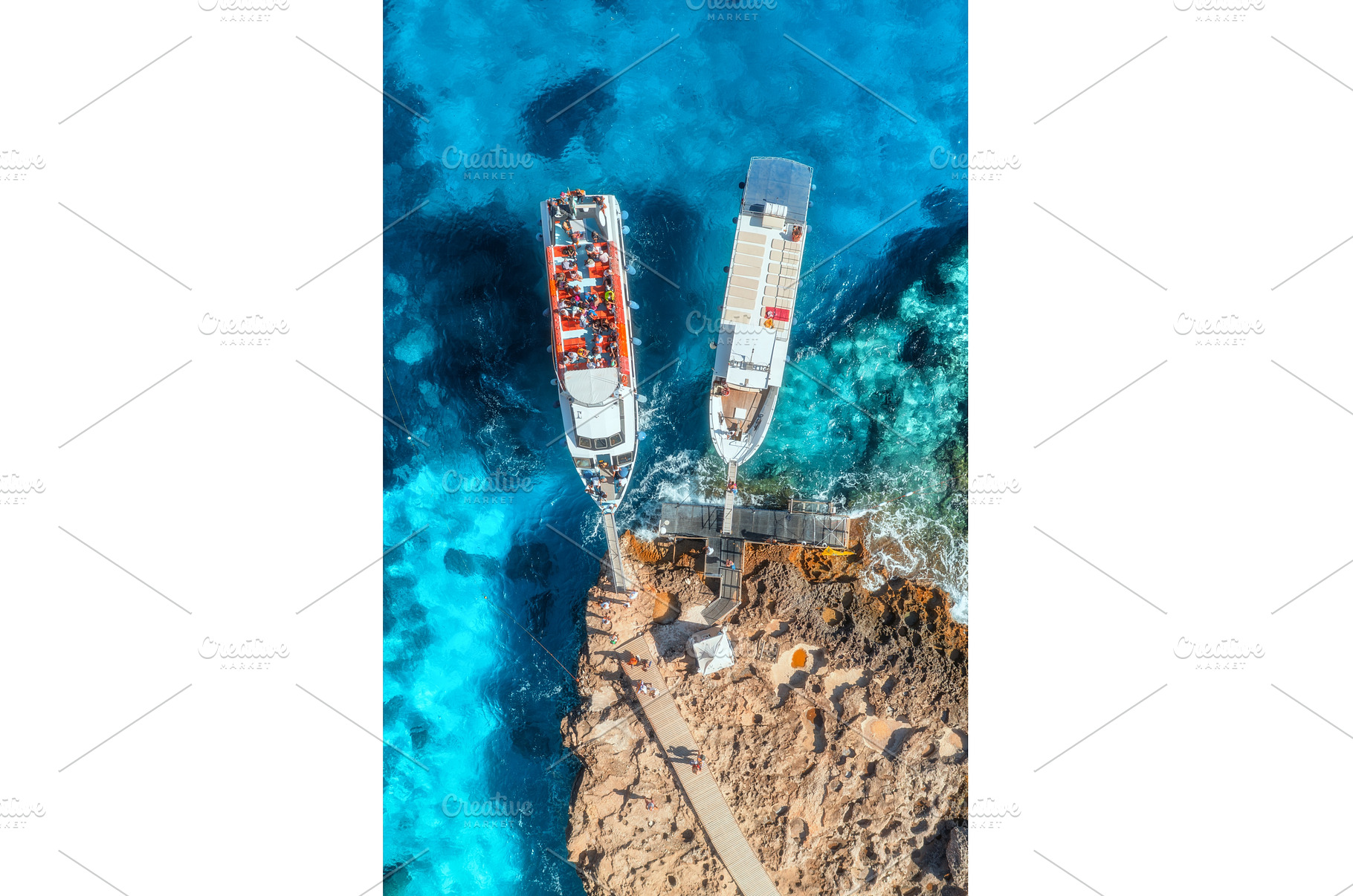 Aerial view of boat and rocky sea, a Transportation Photo by den-belitsky