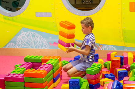 boy playing with building toy blocks