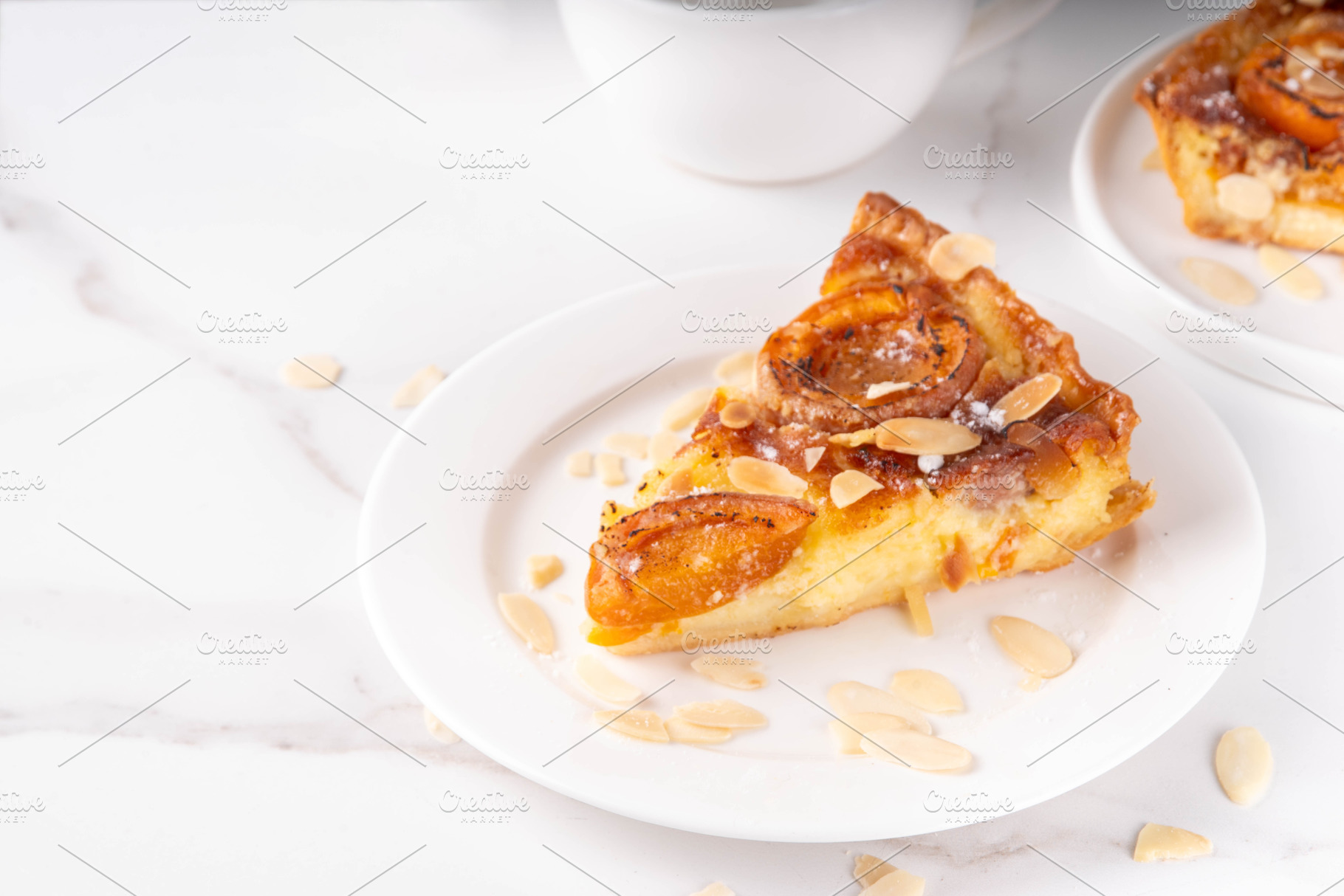 Traditional French almond cake with frangipane and apricots, a Food & Drink Photo by Rimma