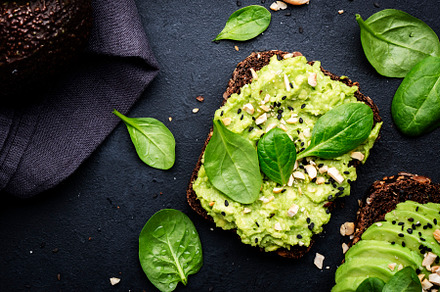 Avocado toast with rye bread with spinach, crushed cashew nuts a, a Food & Drink Photo by 5PH