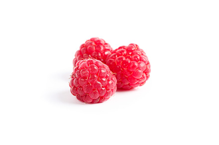 Fresh sweet raspberries isolated on white background, a Food & Drink Photo by AtlasStudio