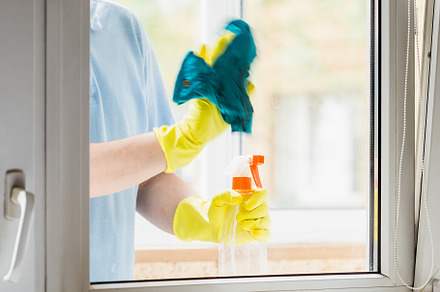 Man in rubber gloves cleaning window, a Person Photo by Andriana Syvanych
