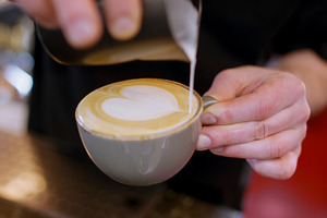 Cappuccino serving decorating drink barista hand, a Person Photo by Photo Drive Studio