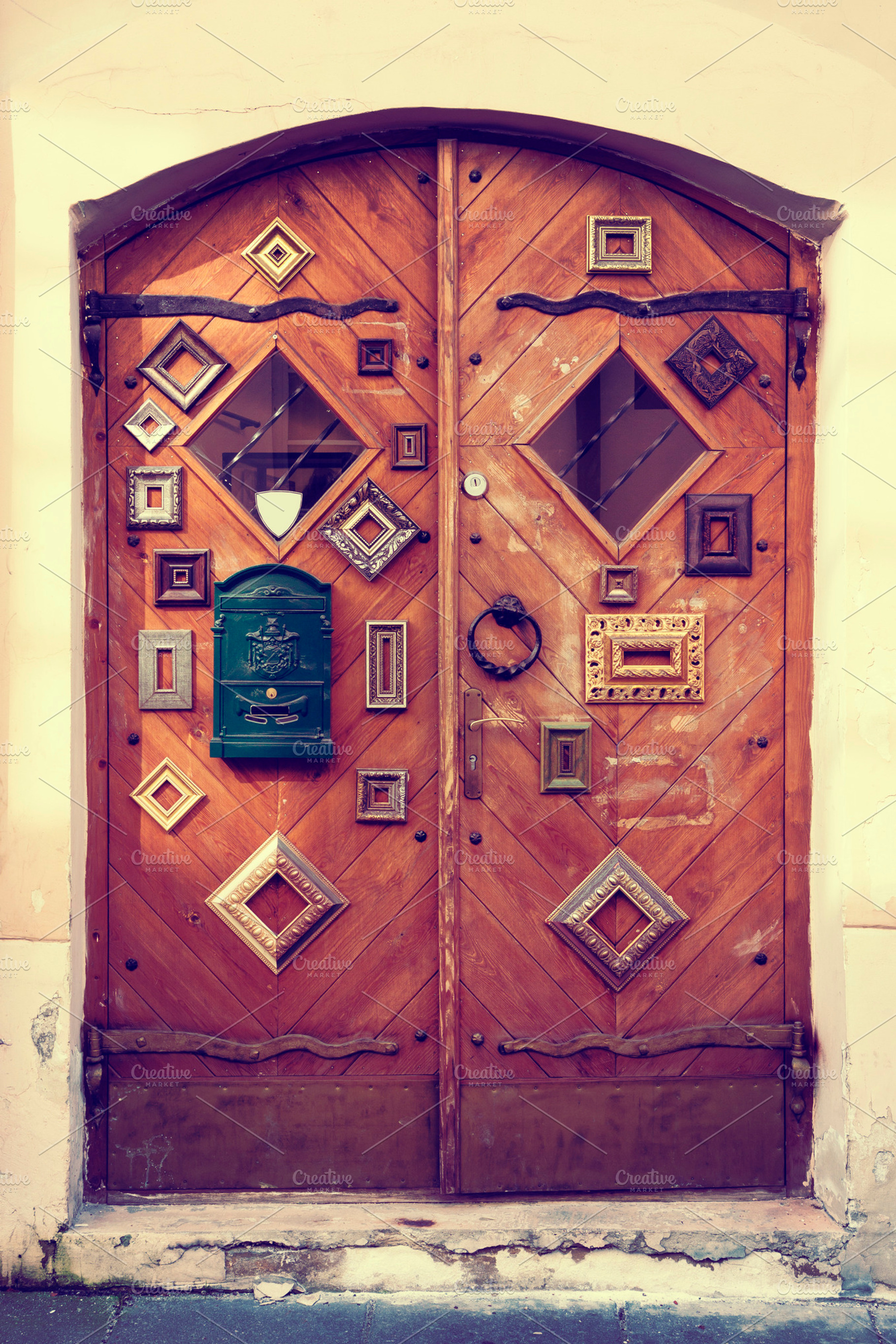 Doors decorated with picture frames, an Architecture Photo by BOOCYS