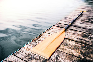 Paddle on wooden dock. Concept of, a Sports & Recreation Photo by HalfPoint