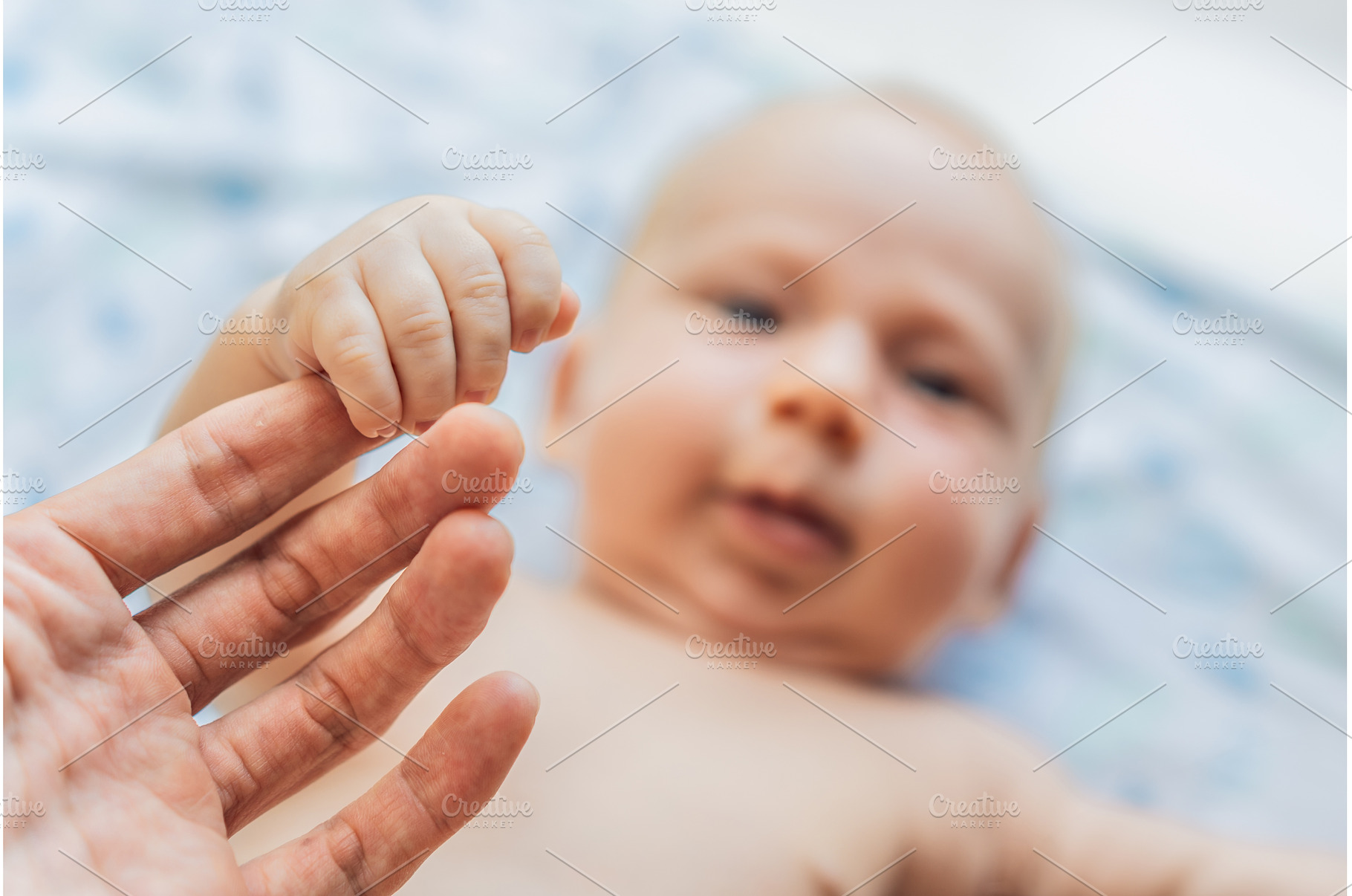 Newborn baby lying on a soft blanket, a Person Photo by Elizaveta Galitskaya