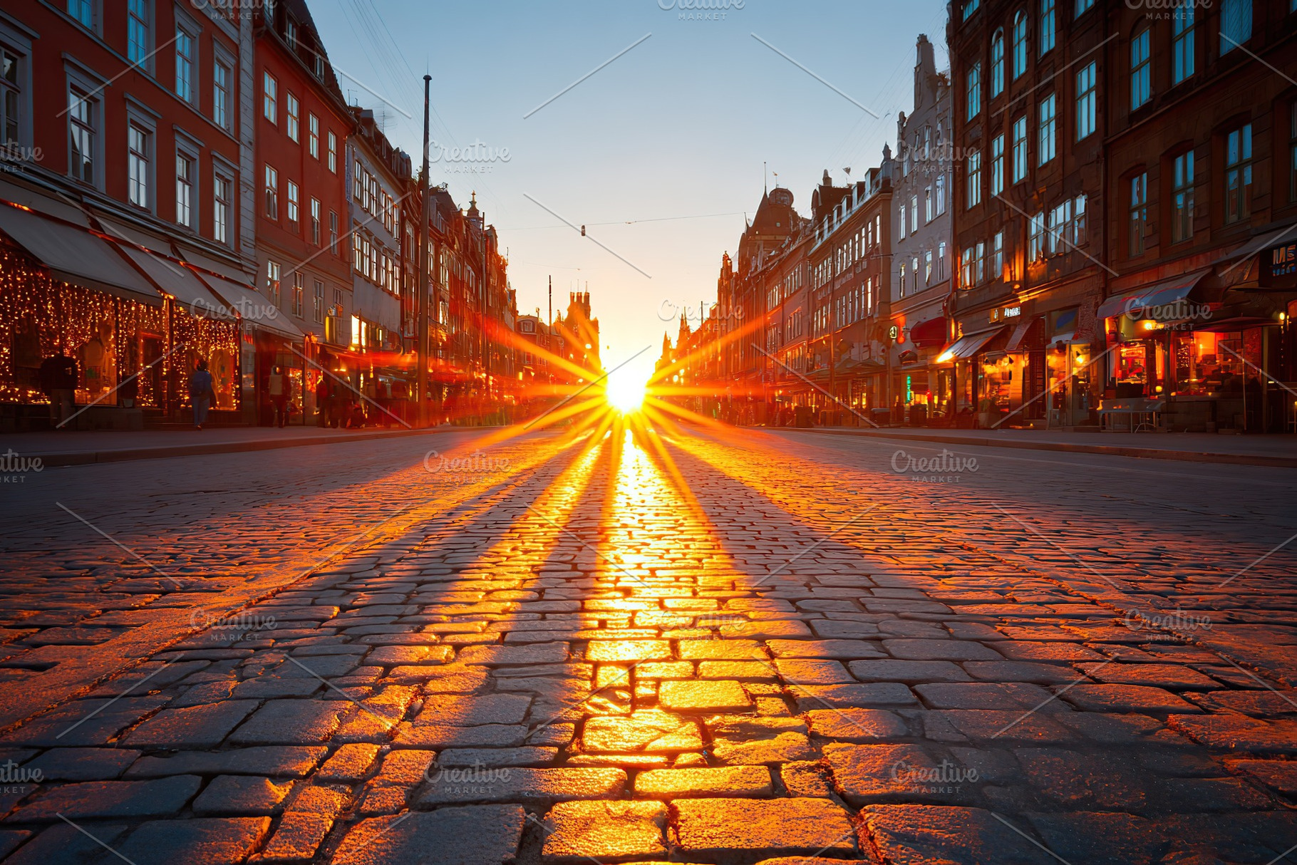 Sunset casts long shadows on cobblestone street in charming old town, a Photo by AlyaAnd