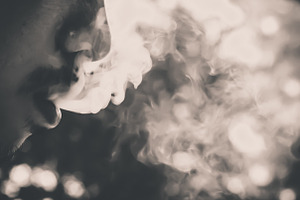 Man smoking stock photo containing smoke and weed