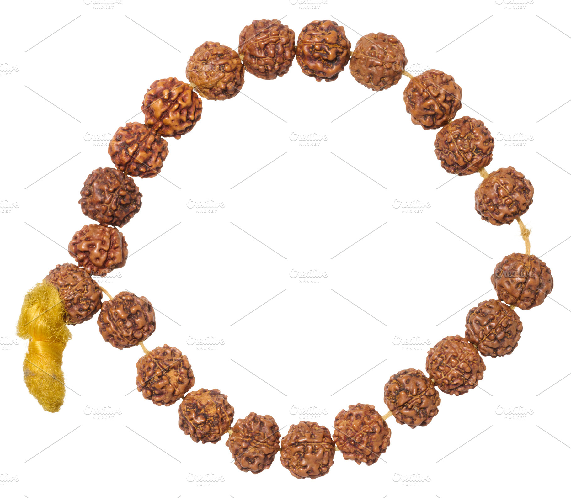 A Rudraksha bracelet made of brown beads with a yellow tassel, f, an Abstract Photo by ndanko