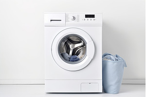 Modern washing machine with laundry, a Technology Photo by Ylivdesign