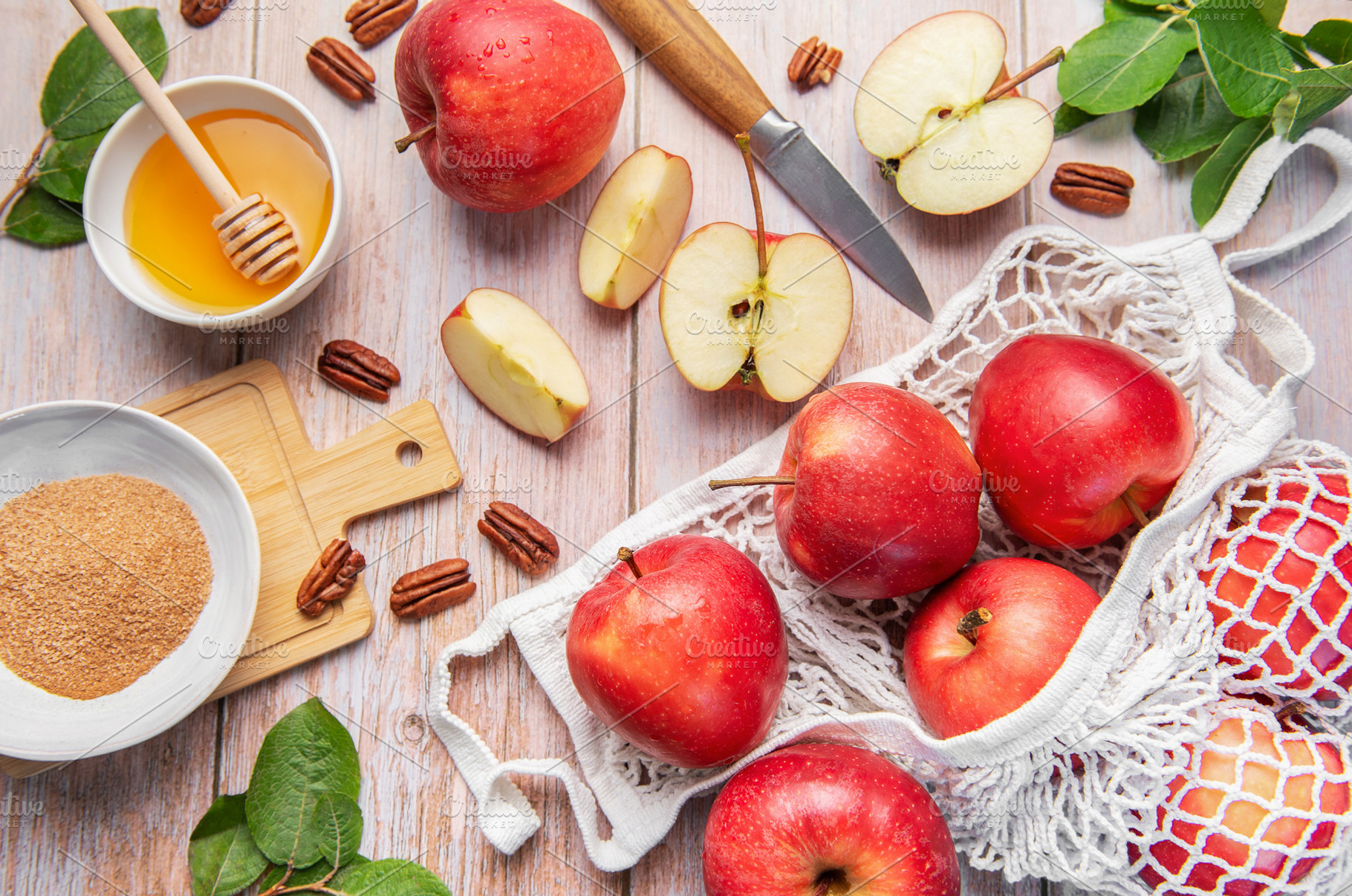 Red apples, honey, pecans, cinnamon for autumn baking, a Food & Drink Photo by Olena Rudo