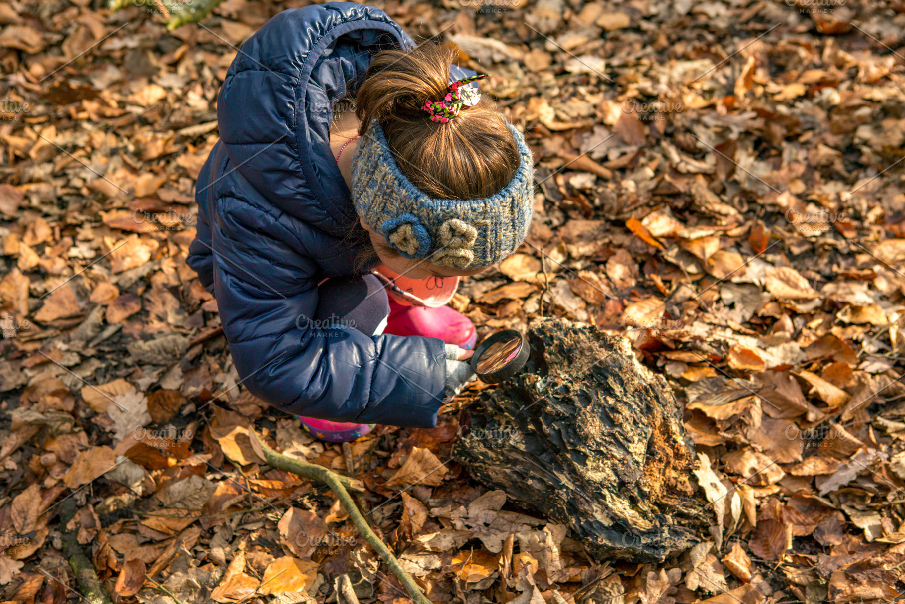Little girl with magnifying glass, a School & Education Photo by misign