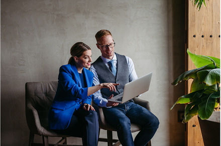 Portrait of young colleagues sitting, a Business Photo by HalfPoint