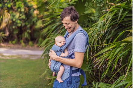 Young father walks in nature with