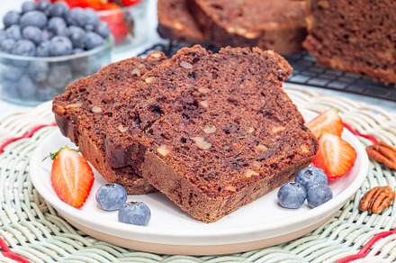 Homemade chocolate zucchini or courgette bread with pecan nuts, horizontal, a Food & Drink Photo by iuliia_n