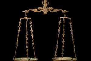 Antique weighing scale stock photo containing judge and hand