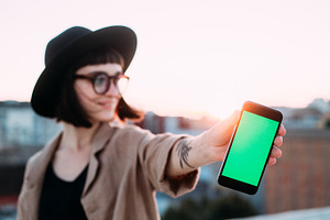 Cute hipster girl with mockup phone featuring background, woman, and