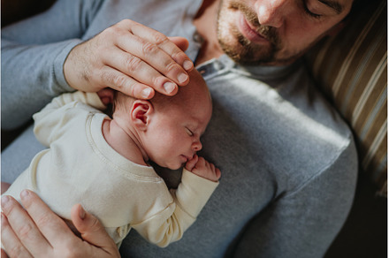 Close-up of father cudddling his, a Person Photo by HalfPoint