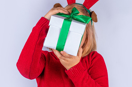 Christmas holiday background with funny girl, a Holiday Photo by Rimma