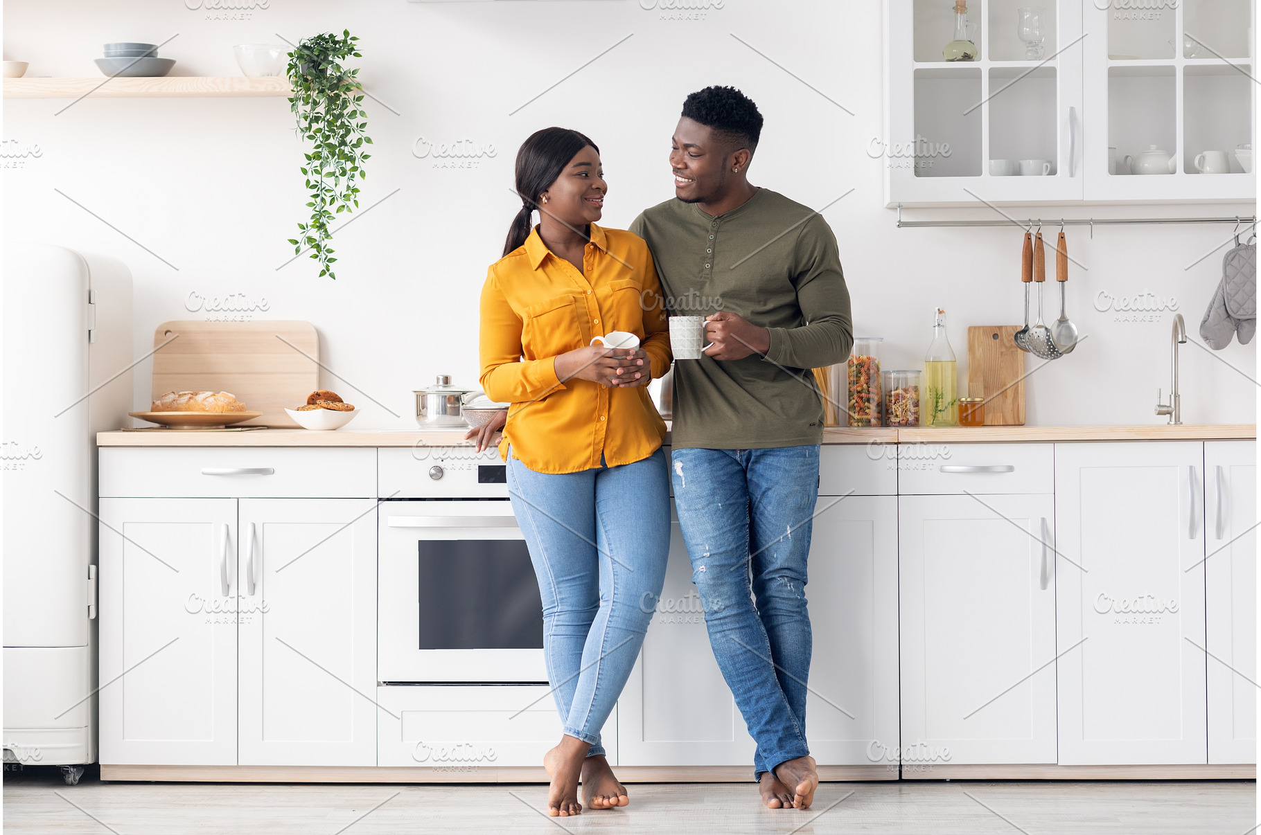 Cherful Young Black Couple Drinking, a Person Photo by Prostock-Studio