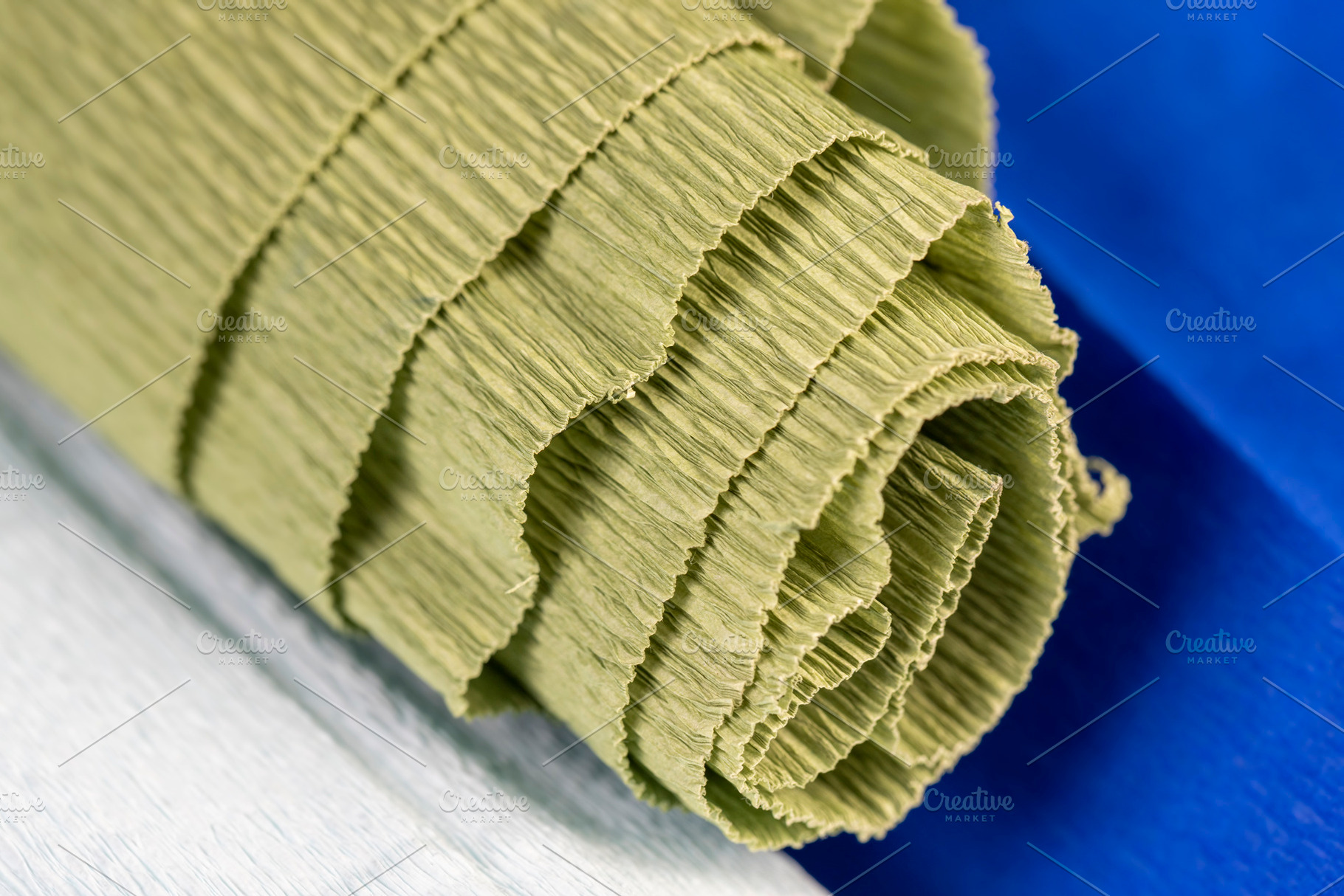 colored crumpled corrugated paper for handmade closeup, side view, a Photo by rsoollAI