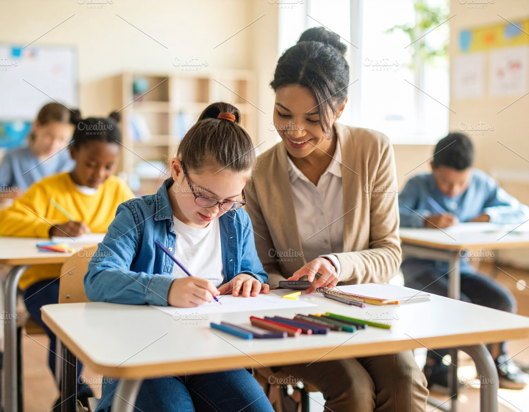 Young teacher with down syndrome girl at classroom, a School & Education Photo by DanFLCreativo