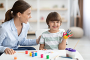 Art classes for children. Happy little boy with colorful painted palm showing h, a Photo by Prostock-Studio (Thumbnail 2 of 2)