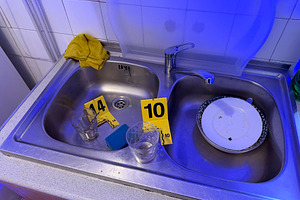 Crime scene in kitchen with evidence markers