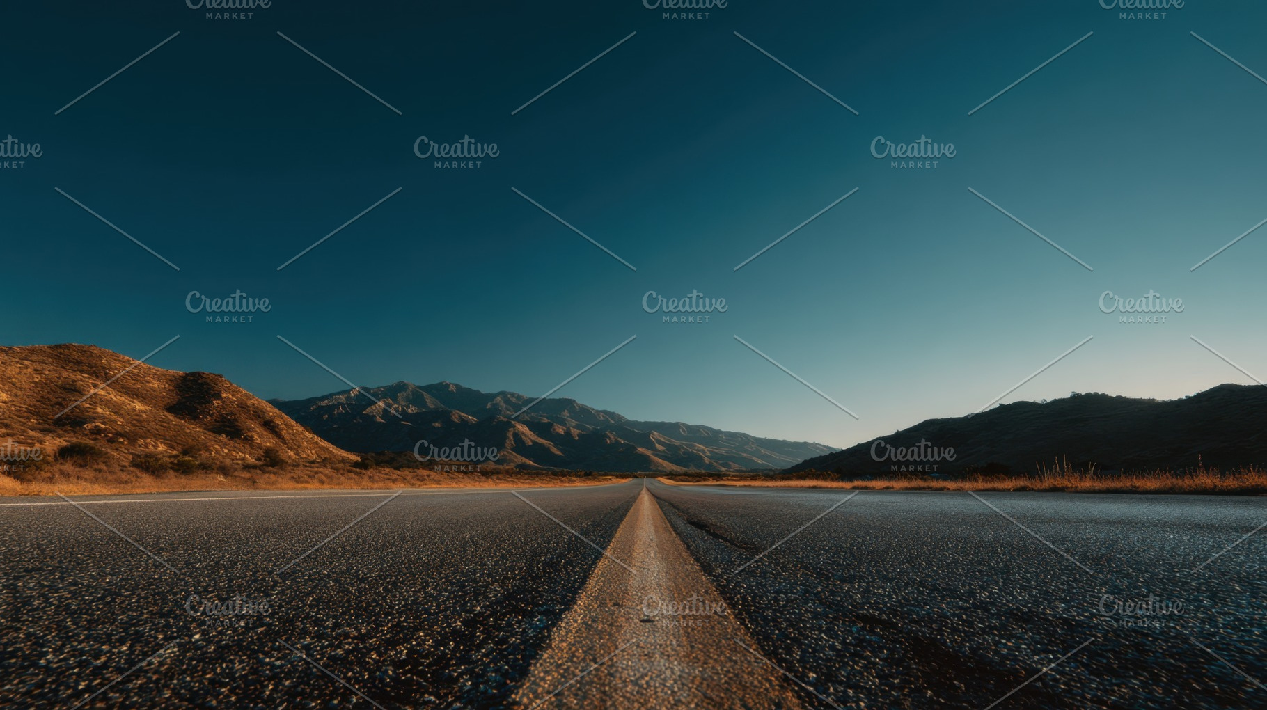 Road through mountains at sunset, a Photo by Beautiful things