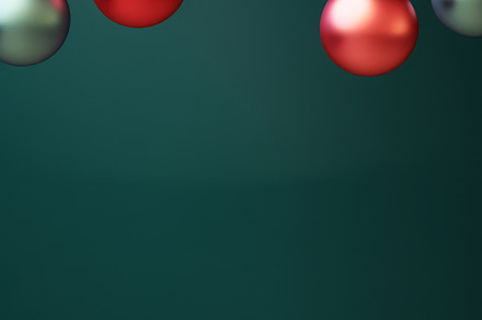 Christmas red and green matte ornaments on teal green background, a Photo by Dvoevnore photos