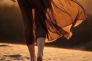 Woman in Flowing Skirt Walking, a Person Photo by Virgo Studio