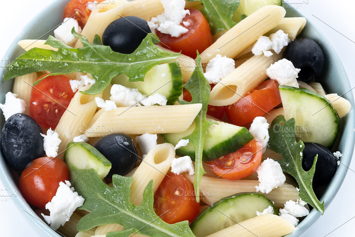 Mediterranean Pasta Salad in bowl with Fresh Vegetables and Herbs isolated on w, a Food & Drink Photo by etorres69 (Photo 2 of 2)