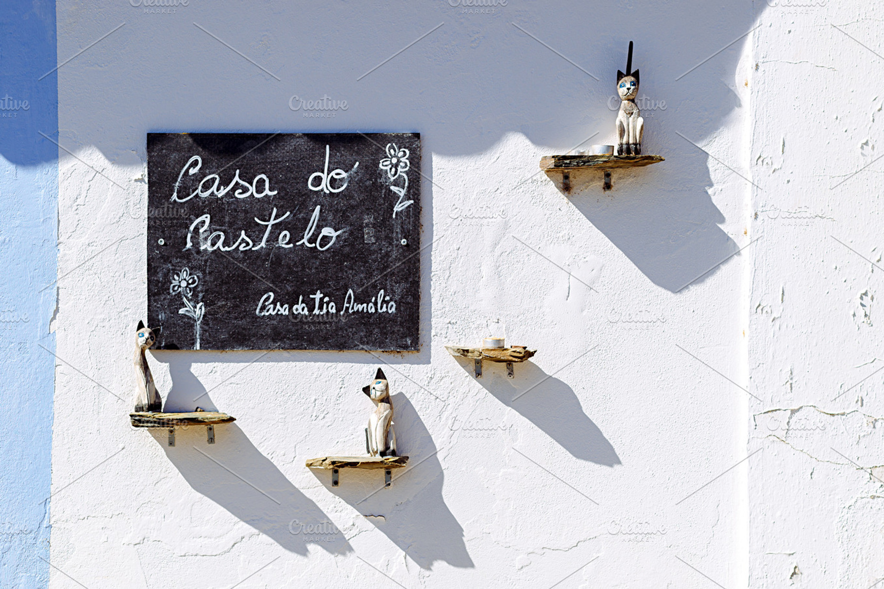 Detail of decorated wall with cats stock photo containing door and old, an Architecture Photo by Shootdiem