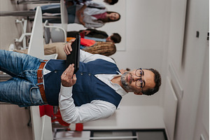 Teacher holding a tablet in modern, a School & Education Photo by HalfPoint