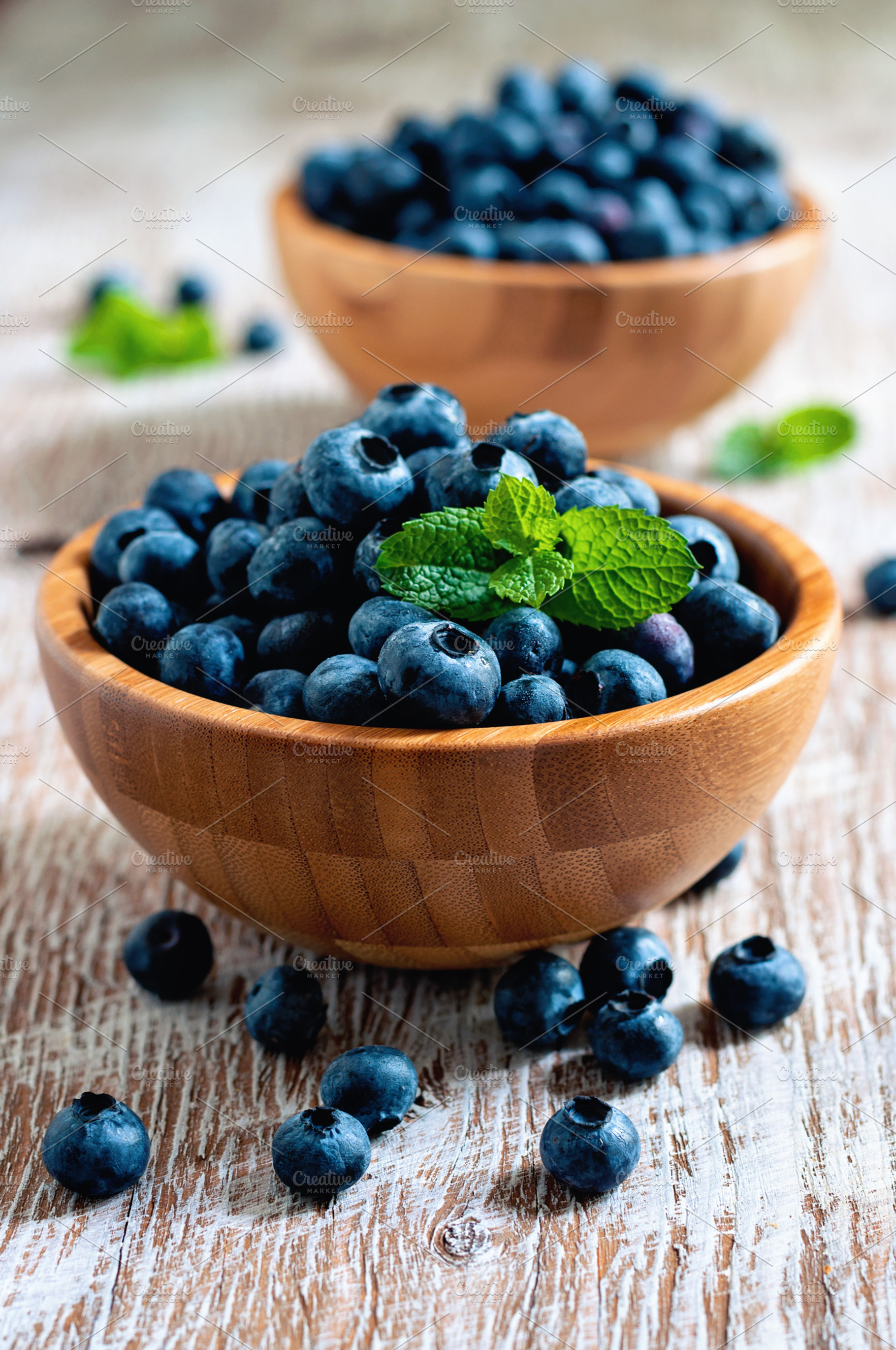 Blueberries in wooden bowls featuring blueberries, background, and berry, a Food & Drink Photo by RosyMaple