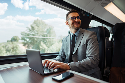 Businessman in fast train, a Transportation Photo by REDDOT Studio