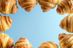 French pastry croissants with copyspace for text, a Food & Drink Photo by AlyaAnd