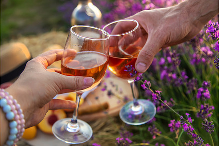 Wine in glasses is held by a woman, a Person Photo by yanadjana