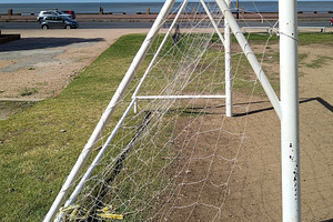Soccer goal in front of waterfront street, a Sports & Recreation Photo by DanFLCreativo