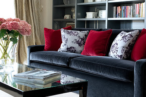 Elegant living room interior with a velvet sofa and decorative c, a Photo by Studio ANNA