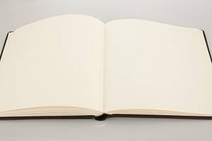 Open book showing blank pages on white background, an Abstract Photo by Antonio Gravante Market
