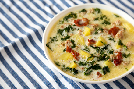 Homemade Zuppa Toscana with Kale and Bread in a white bowl, low, a Food & Drink Photo by LiudmylaChuhunova