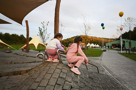 Children playing on playground in autumn park. Kids having fun o, a Person Photo by AS photostudio