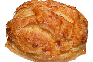 A golden brown puff pastry pastry with a textured texture, a bun, a Food & Drink Photo by ndanko