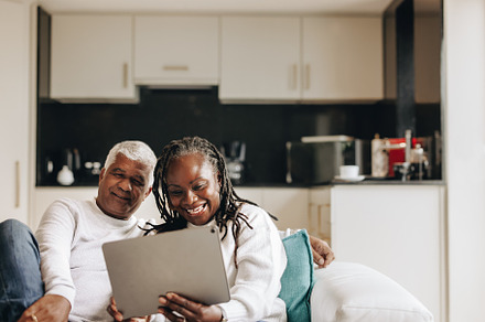 Cheerful senior couple having a video call on a digital tablet, a Person Photo by Jacob Lund