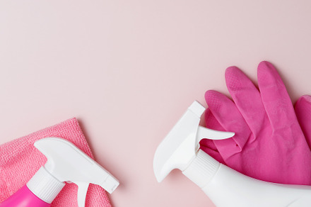 Household cleaning and hygiene concept. Pink cleaning supplies including rubber, a Photo by matucha