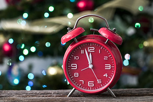 Bright red alarm clock sits on woode, a Holiday Photo by 1miromiro