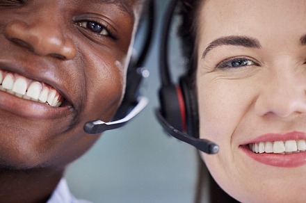 Black man, woman and call center in closeup, smile and portrait for teamwork, help and customer service. Crm expert, telemarketing team and consulting for tech support with diversity, vision or pride, a Photo by Peopleimages.com